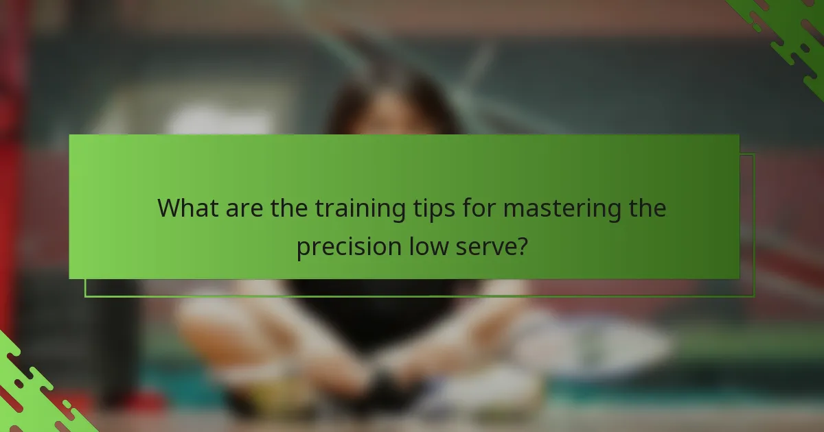 What are the training tips for mastering the precision low serve?